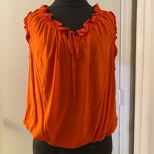 Orange ruffled sleeveless top. PXL